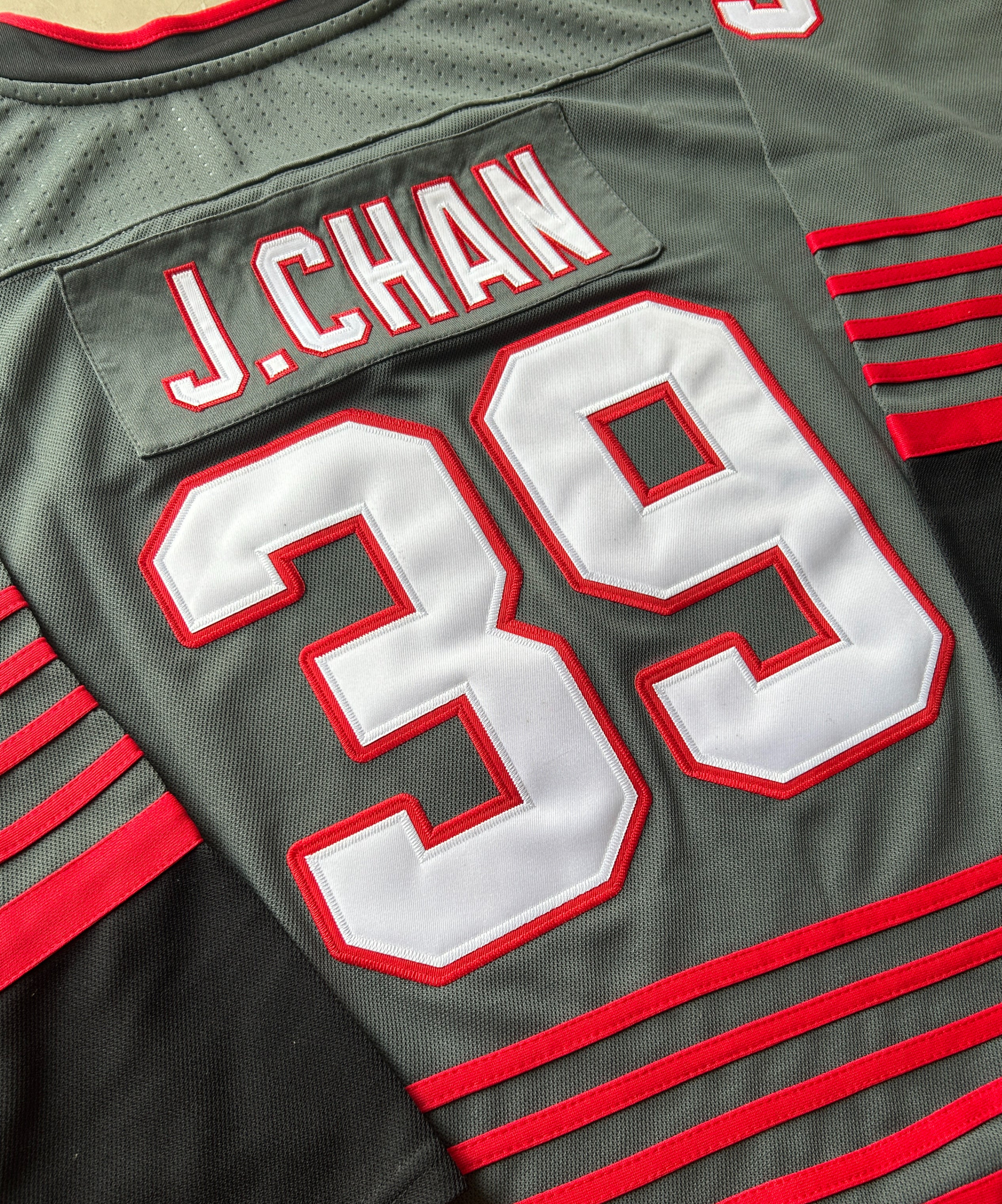 Premium custom hockey jersey featuring embroidered crest, tackle-twill numbers, reinforced collar