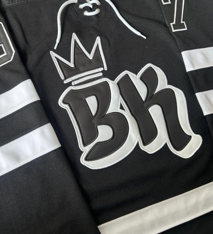 A close up picture of a high quality twill custom hockey jersey logo
